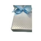 White Quilted Wrapping with Blue Ribbon
