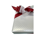 White Quilted Wrapping with Red Ribbon