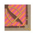 Folded fuchsia napkin with an equestrian motif that includes silhouettes of horses and stirrups against an orange and pink striped background.